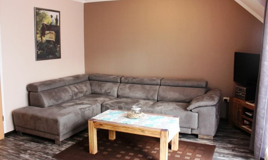 Ferienwohnung Tag am Meer – große Wohnlandschaft mit Flachbildfernseher
